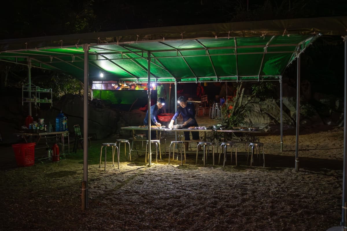 The chef prepares and cooks delicious meals right inside the cave.